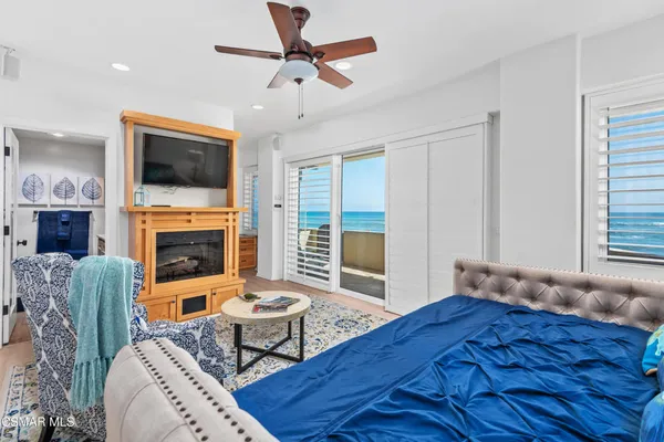 a living room with furniture fireplace and a flat screen tv