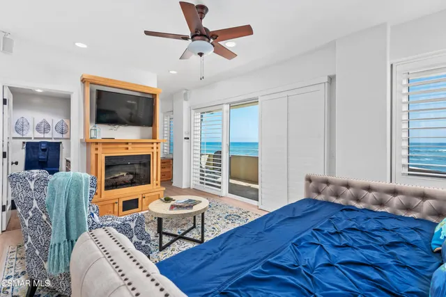 a living room with furniture fireplace and a flat screen tv