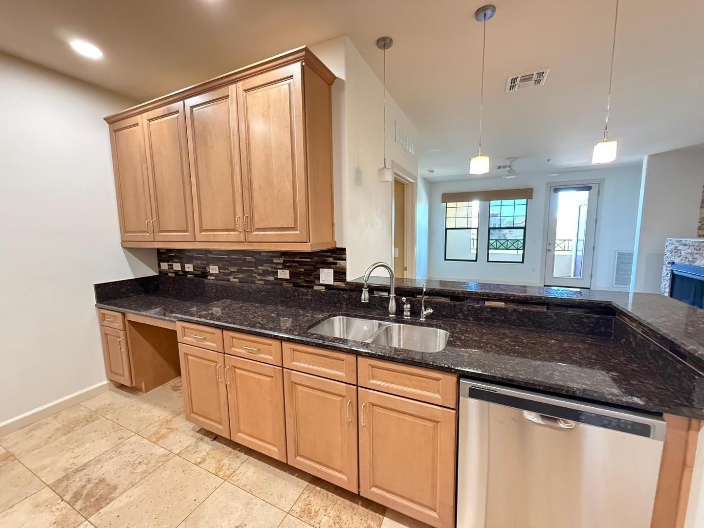 7291 North Scottsdale Road, Unit 3003 Paradise Valley, AZ 85253 - Photo 26 of 45 a kitchen with granite countertop a sink and white cabinets