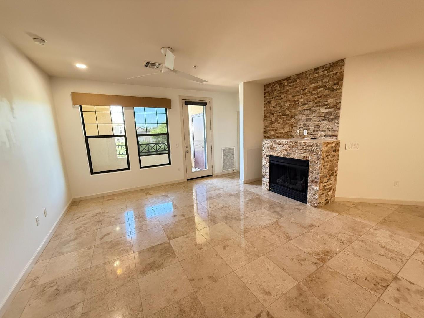 7291 North Scottsdale Road, Unit 3003 Paradise Valley, AZ 85253 - Photo 27 of 45 an empty room with windows and fireplace