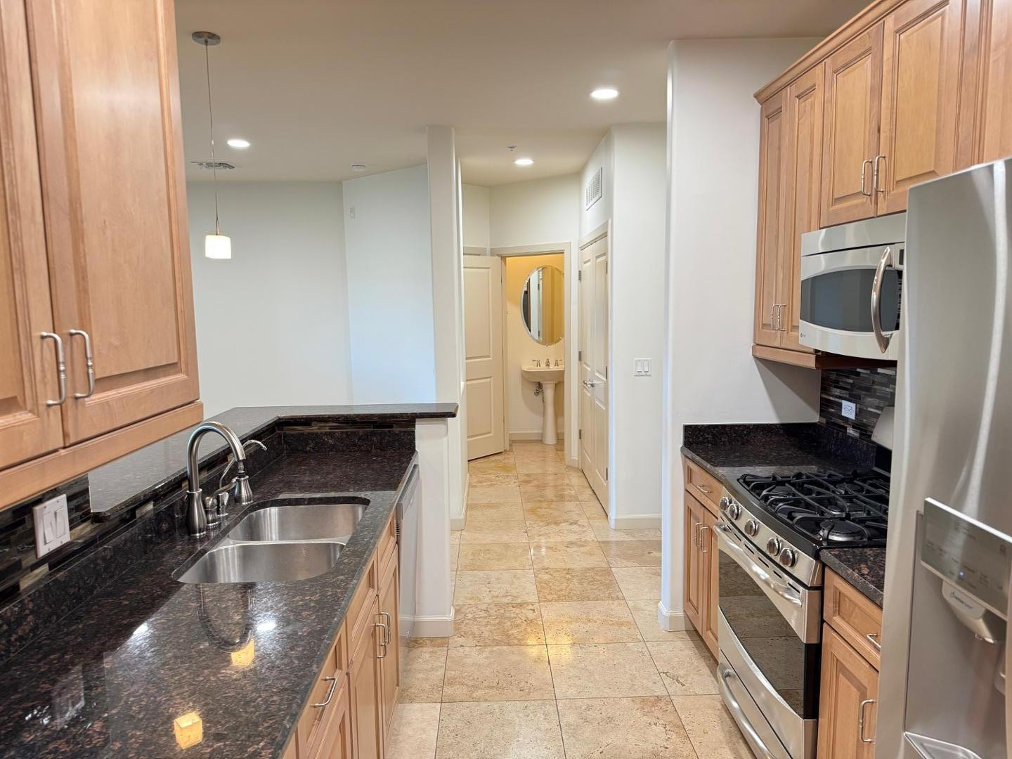 7291 North Scottsdale Road, Unit 3003 Paradise Valley, AZ 85253 - Photo 41 of 45 a kitchen with granite countertop a stove a sink and a refrigerator