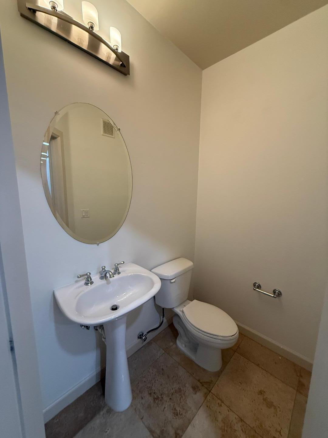 7291 North Scottsdale Road, Unit 3003 Paradise Valley, AZ 85253 - Photo 6 of 45 a bathroom with a sink a toilet and a mirror