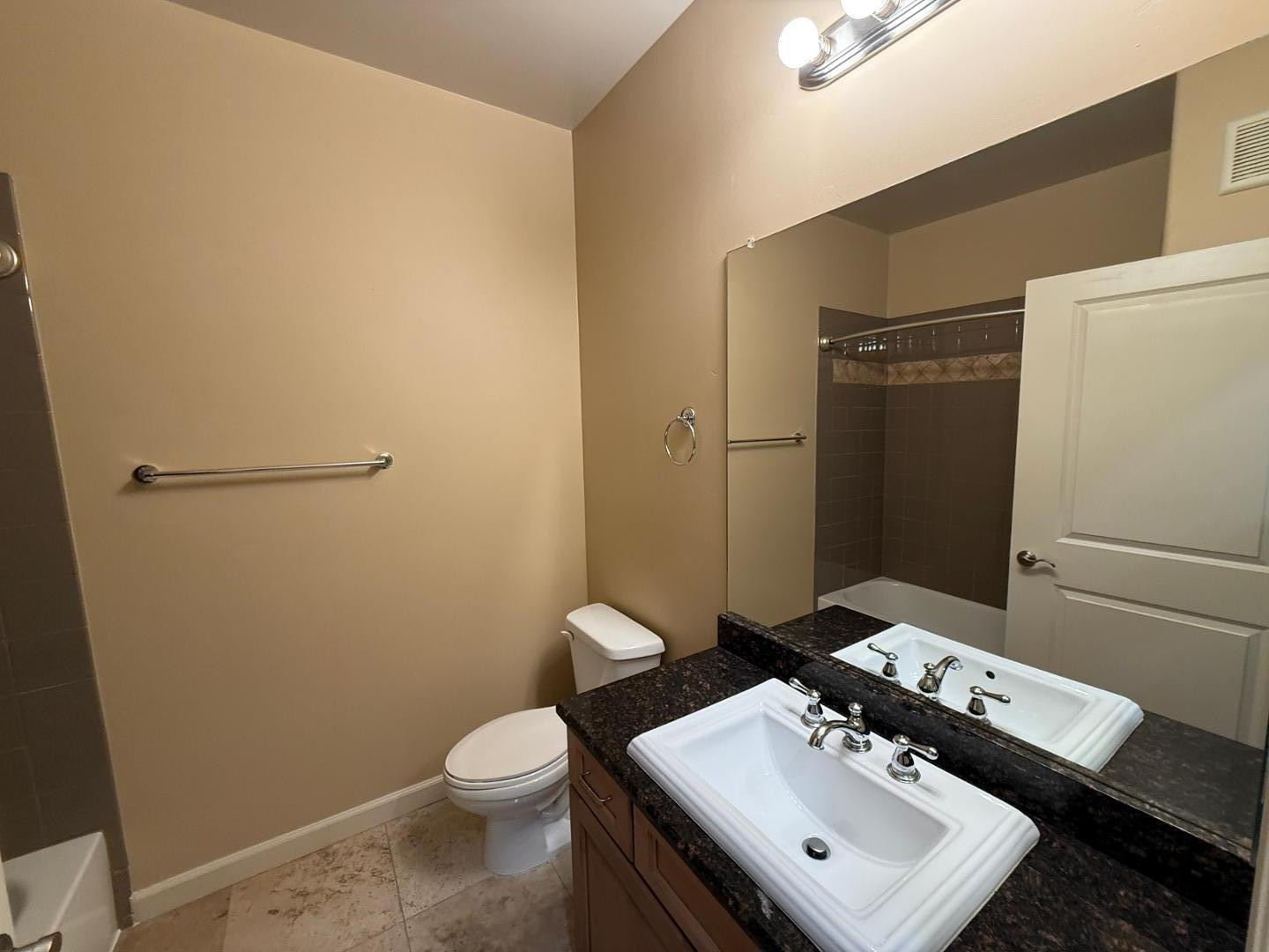 7291 North Scottsdale Road, Unit 3003 Paradise Valley, AZ 85253 - Photo 9 of 45 a bathroom with a sink toilet and mirror