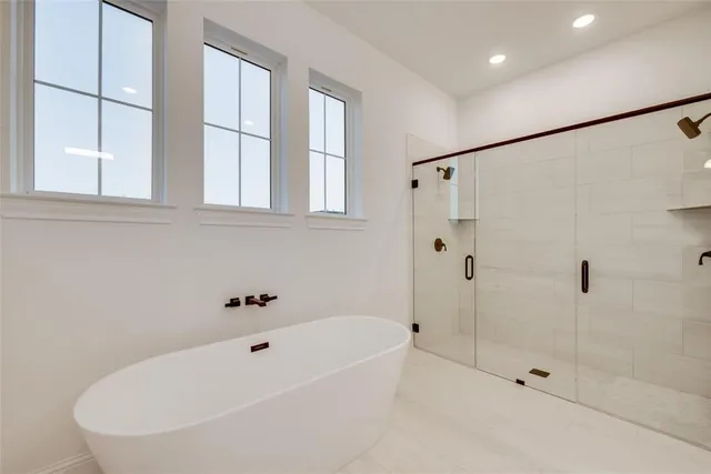 a white bath tub sitting next to a window