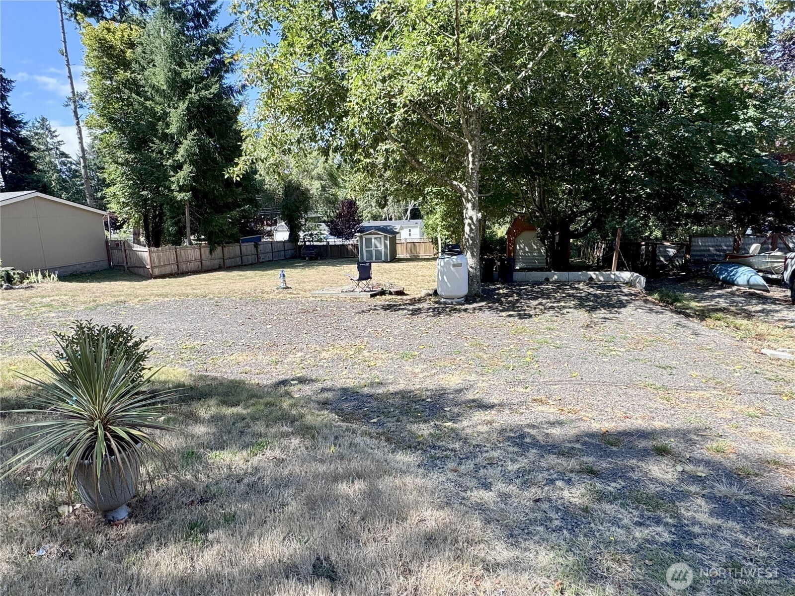 0 175th Avenue Southwest Longbranch, WA 98351 - Photo 3 of 19 a white house that has a tree in front of it