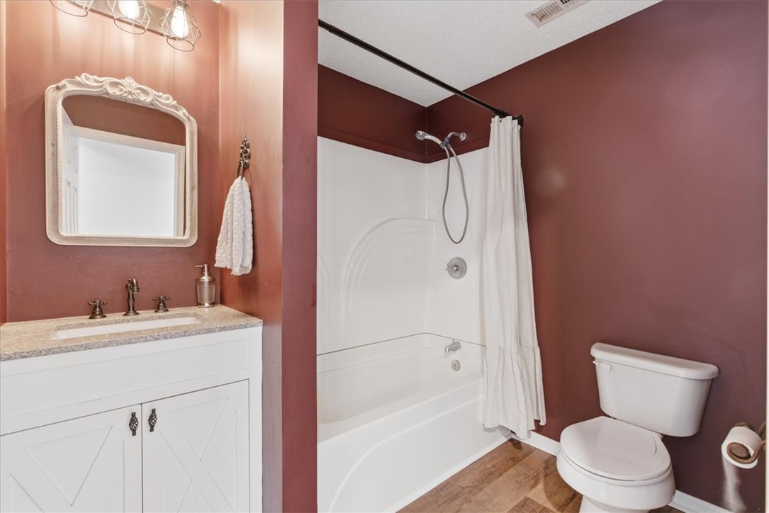 112 Newry Road Seneca, SC 29672 - Photo 10 of 19 This bathroom features a sleek vanity, elegant mirror, and modern shower area.