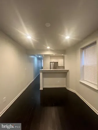 a view of entryway with kitchen