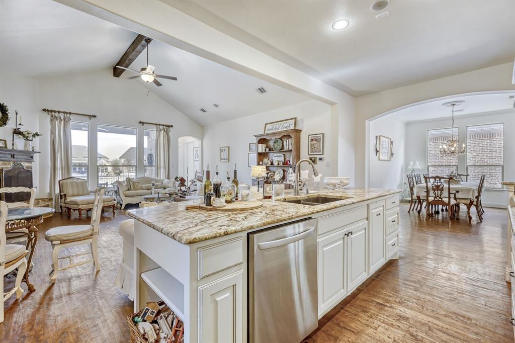 1425 Wildrye Ridge Celina, TX 75009 - Photo 11 of 32 a kitchen with lots of counter top space and view of living room