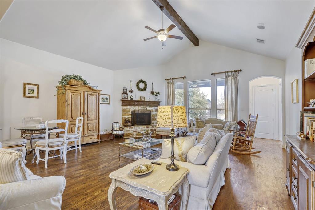 1425 Wildrye Ridge Celina, TX 75009 - Photo 13 of 32 a living room with furniture a flat screen tv and a large window