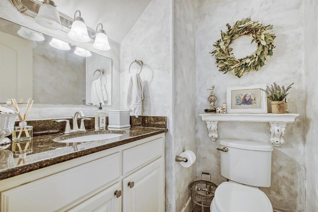 1425 Wildrye Ridge Celina, TX 75009 - Photo 16 of 32 a bathroom with a toilet sink and mirror
