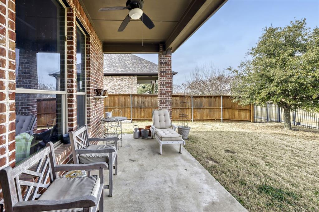 1425 Wildrye Ridge Celina, TX 75009 - Photo 26 of 32 a view of a patio with couches table and chairs and potted plants
