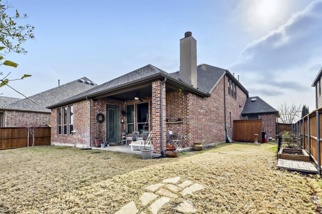 1425 Wildrye Ridge Celina, TX 75009 - Photo 27 of 32 a front view of a house with garden