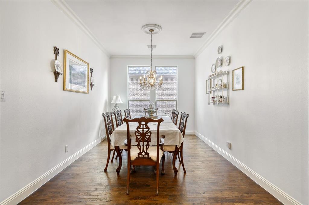 1425 Wildrye Ridge Celina, TX 75009 - Photo 9 of 32 a view of a dining room with furniture window and wooden floor