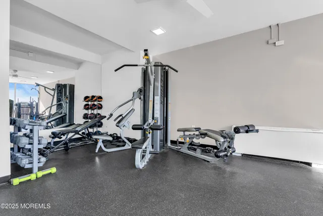a utility room with multiple dryer and washer