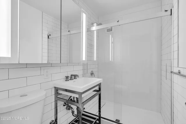 a bathroom with a sink a toilet and a bathtub