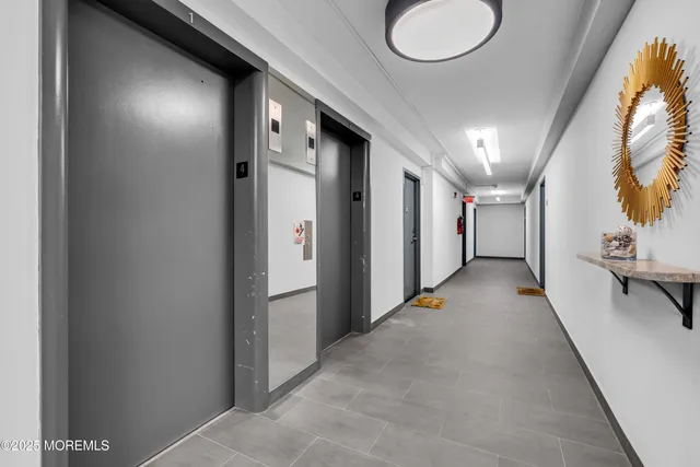 a kitchen with granite countertop a stove a sink and a microwave