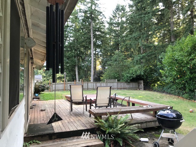 14225 169th Avenue Southeast Renton, WA 98059 - Photo 2 of 8 a view of swimming pool with lawn chairs and a fire pit