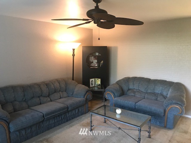 14225 169th Avenue Southeast Renton, WA 98059 - Photo 4 of 8 a living room with furniture and wooden floor