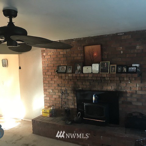 14225 169th Avenue Southeast Renton, WA 98059 - Photo 5 of 8 a living room with a fireplace