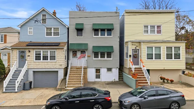 a front view of a house with parking