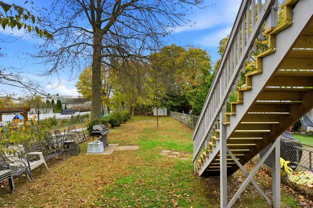 a view of yard with patio