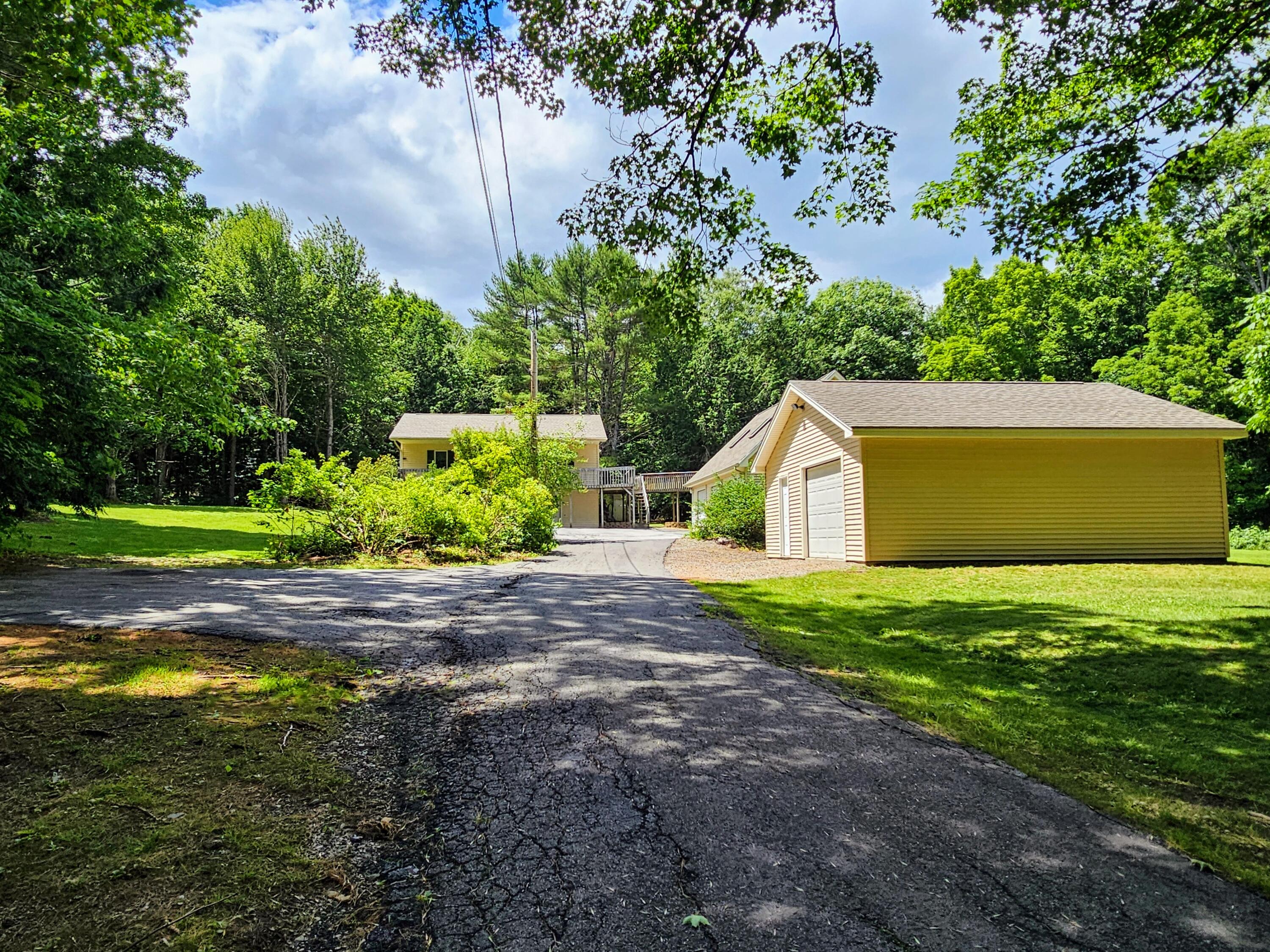 Front view of home and garages