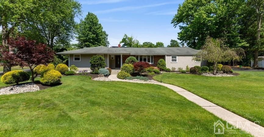 33 Southfield Road Edison, NJ 08820 - Photo 1 of 36 a view of a house with backyard sitting area and garden