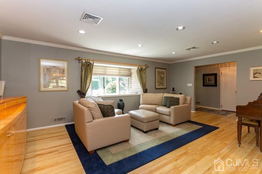 33 Southfield Road Edison, NJ 08820 - Photo 13 of 36 a living room with furniture and a couch