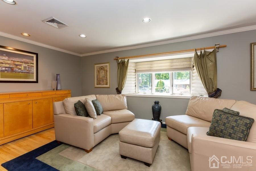 33 Southfield Road Edison, NJ 08820 - Photo 14 of 36 a living room with furniture and a window