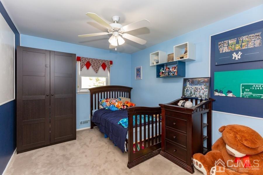 33 Southfield Road Edison, NJ 08820 - Photo 23 of 36 a bedroom with furniture and a window