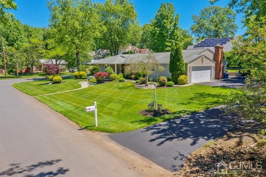 33 Southfield Road Edison, NJ 08820 - Photo 30 of 36 a front view of a house with a yard and garage