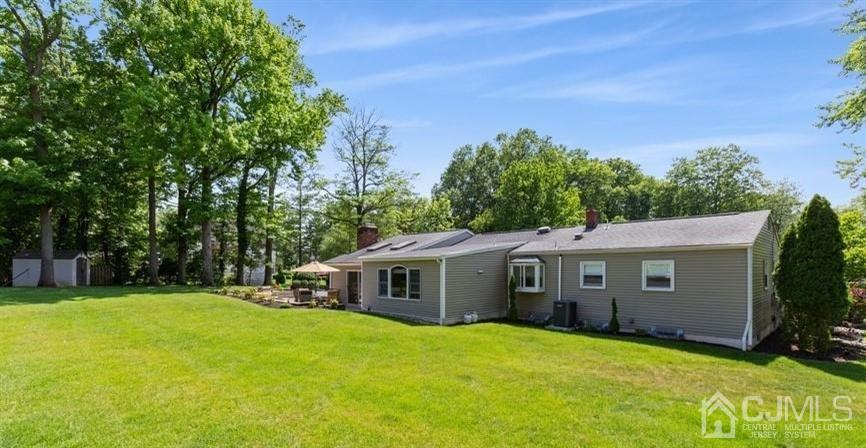 33 Southfield Road Edison, NJ 08820 - Photo 4 of 36 a front view of a house with yard and green space