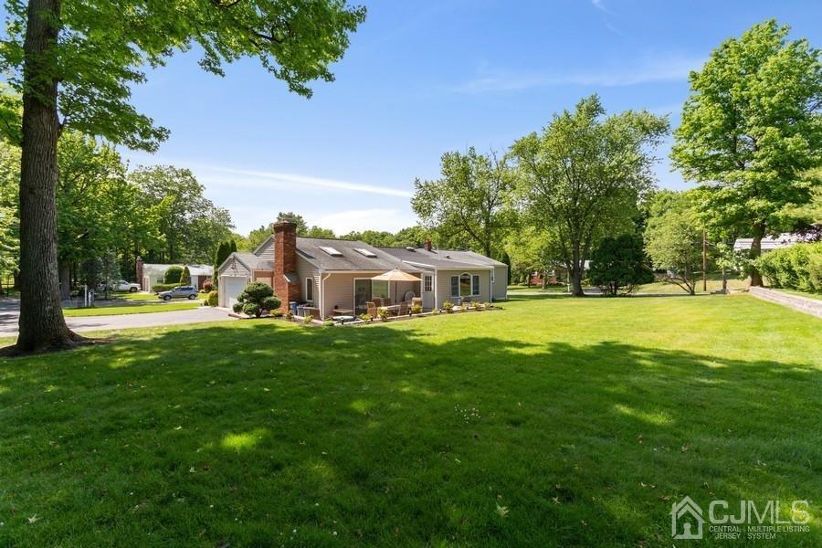33 Southfield Road Edison, NJ 08820 - Photo 5 of 36 a house view with swimming pool in front of it