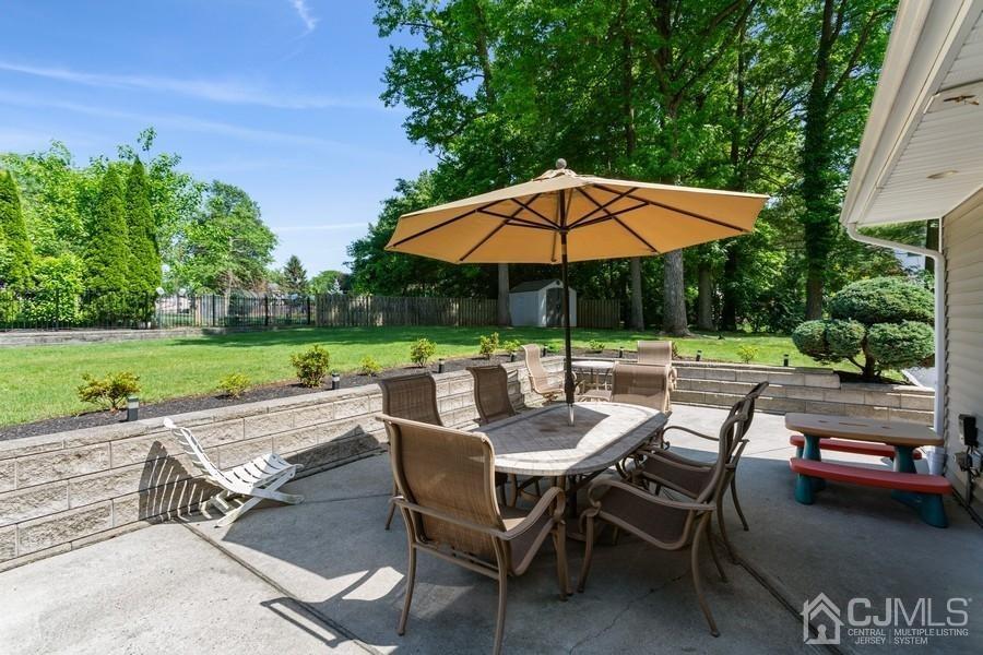 33 Southfield Road Edison, NJ 08820 - Photo 7 of 36 a view of backyard with outdoor seating and green space