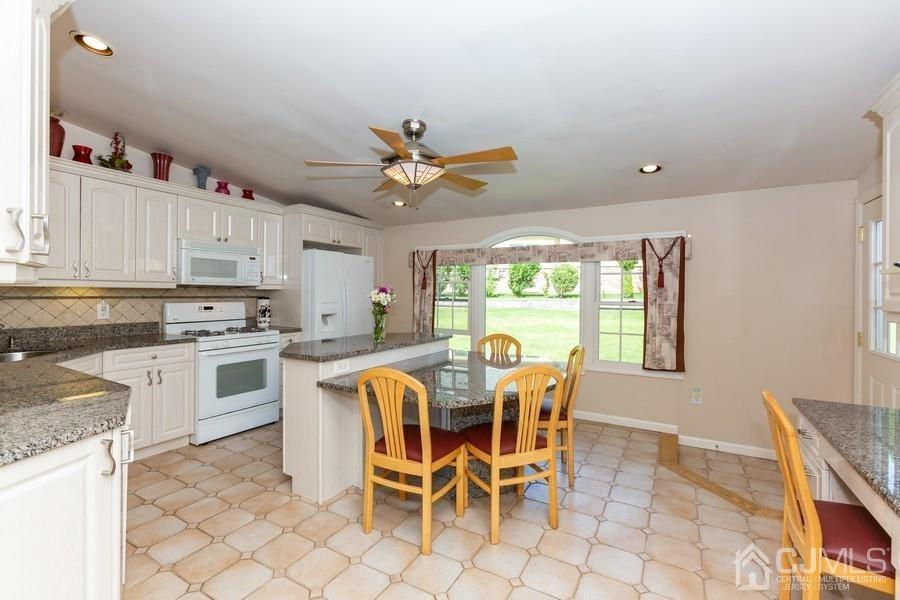 33 Southfield Road Edison, NJ 08820 - Photo 10 of 36 a view of a dining room with furniture window and outside view