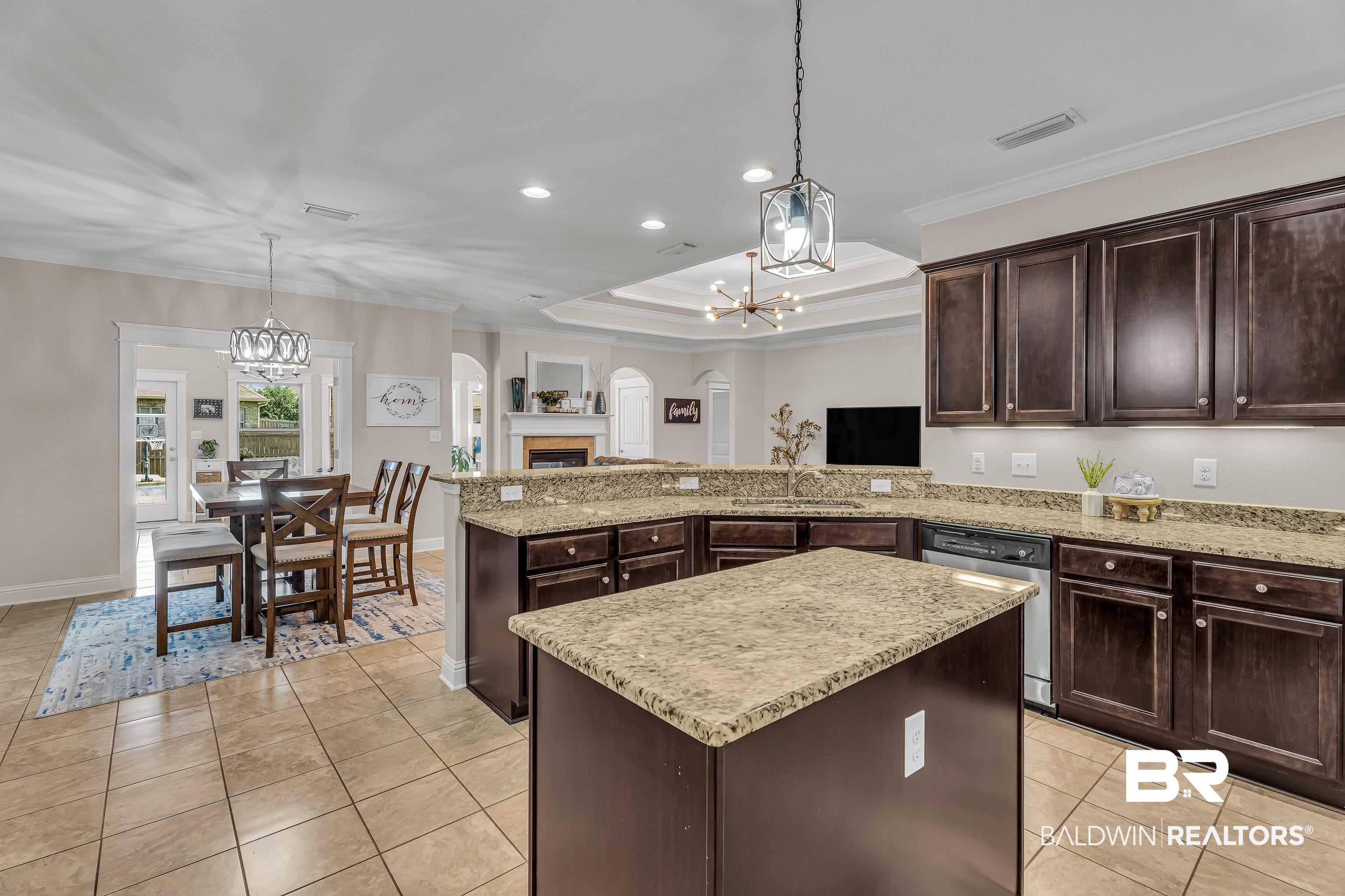 9675 Camberwell Drive Daphne, AL 36526 - Photo 13 of 34 Kitchen with a chandelier, dishwasher, light tile patterned floors, dark brown cabinets, and recessed lighting