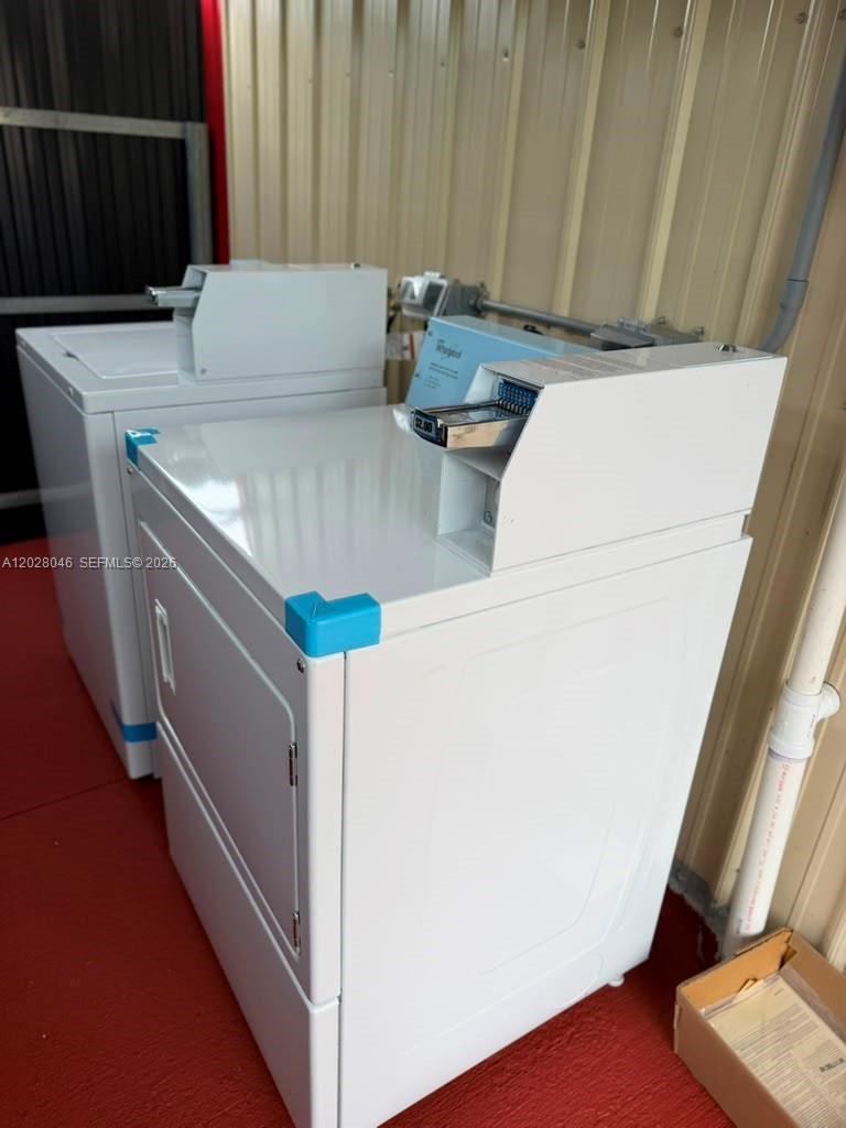 19321 Southwest 196th Street, Unit 1 Miami, FL 33187 - Photo 10 of 10 a view of washer and dryer with wooden floor