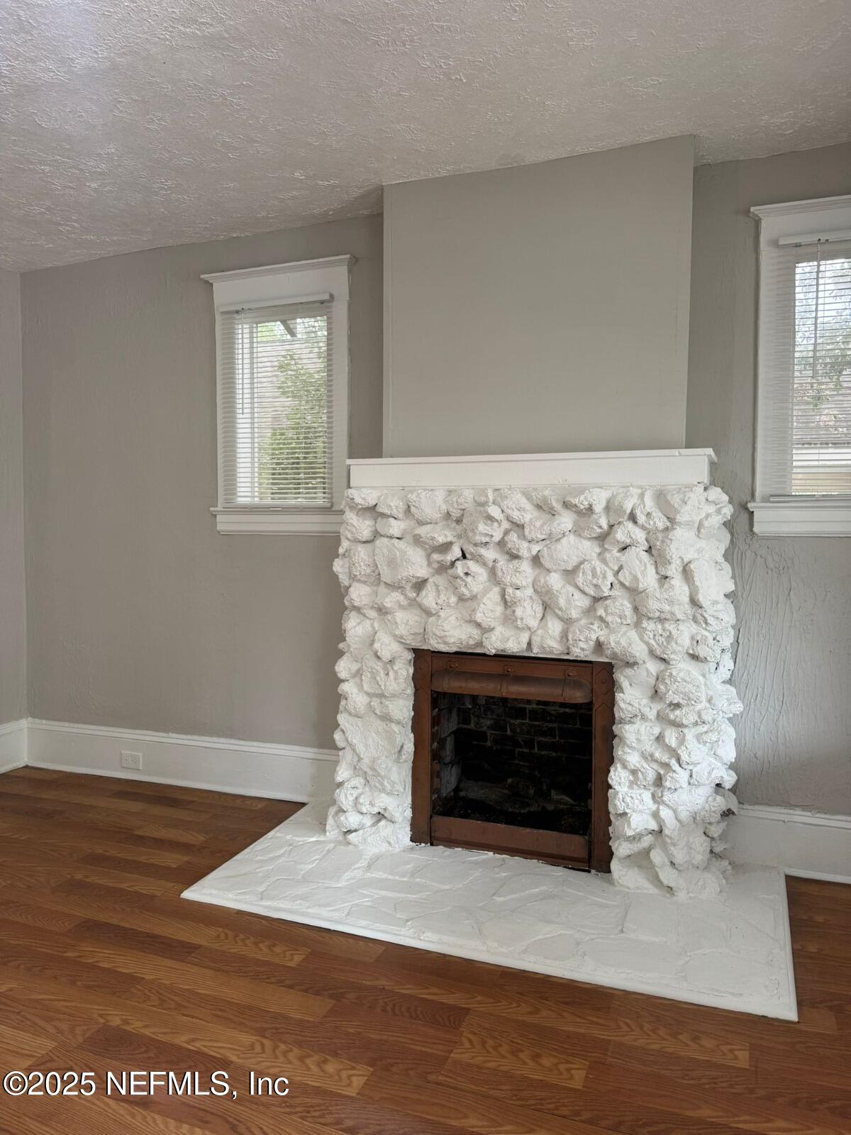 340 West 23rd Street Jacksonville, FL 32206 - Photo 6 of 13 a living room with a fireplace