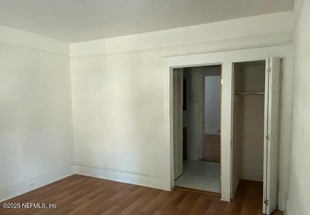 340 West 23rd Street Jacksonville, FL 32206 - Photo 10 of 13 an empty room with wooden floor and closet