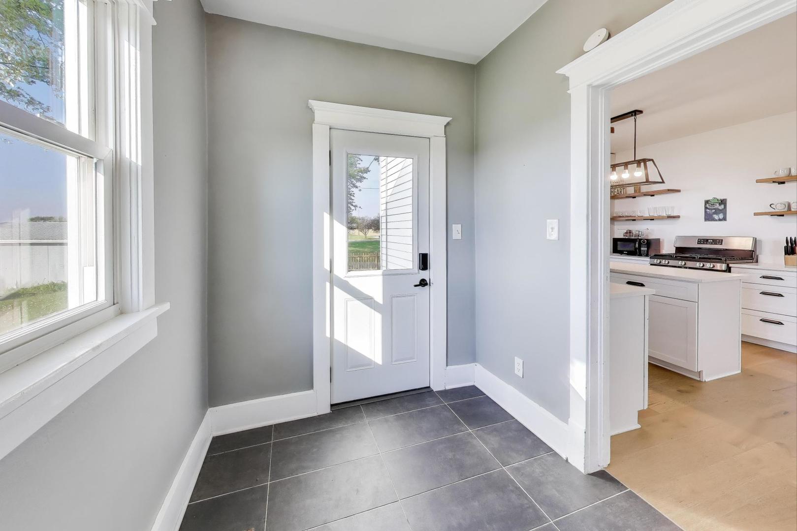 17128 Lukens Road Sycamore, IL 60178 - Photo 18 of 45 a view of a kitchen with a sink and dishwasher kitchen view with wooden floor
