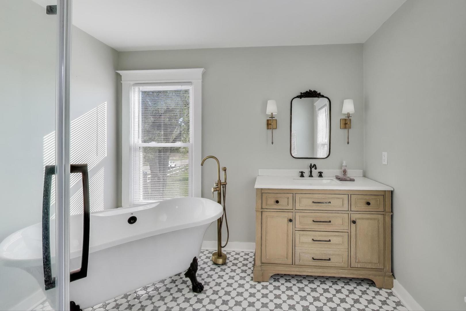 17128 Lukens Road Sycamore, IL 60178 - Photo 23 of 45 a bathroom with a sink a mirror and a bathtub