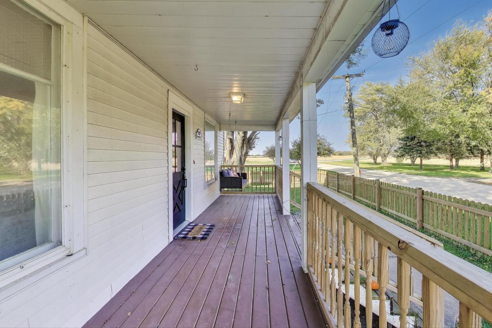 17128 Lukens Road Sycamore, IL 60178 - Photo 5 of 45 a view of a balcony with wooden floor