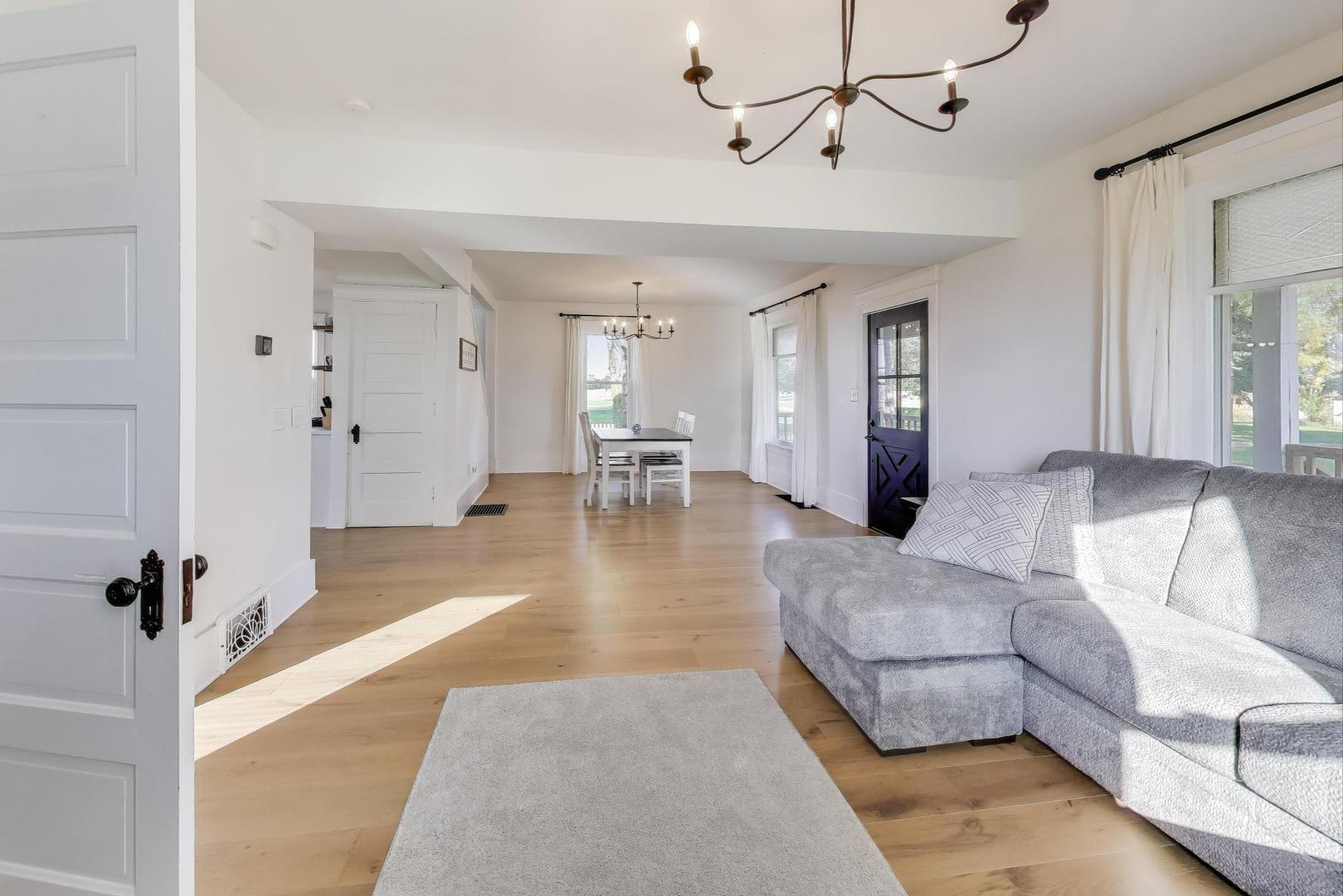 17128 Lukens Road Sycamore, IL 60178 - Photo 9 of 45 a living room with furniture and a chandelier