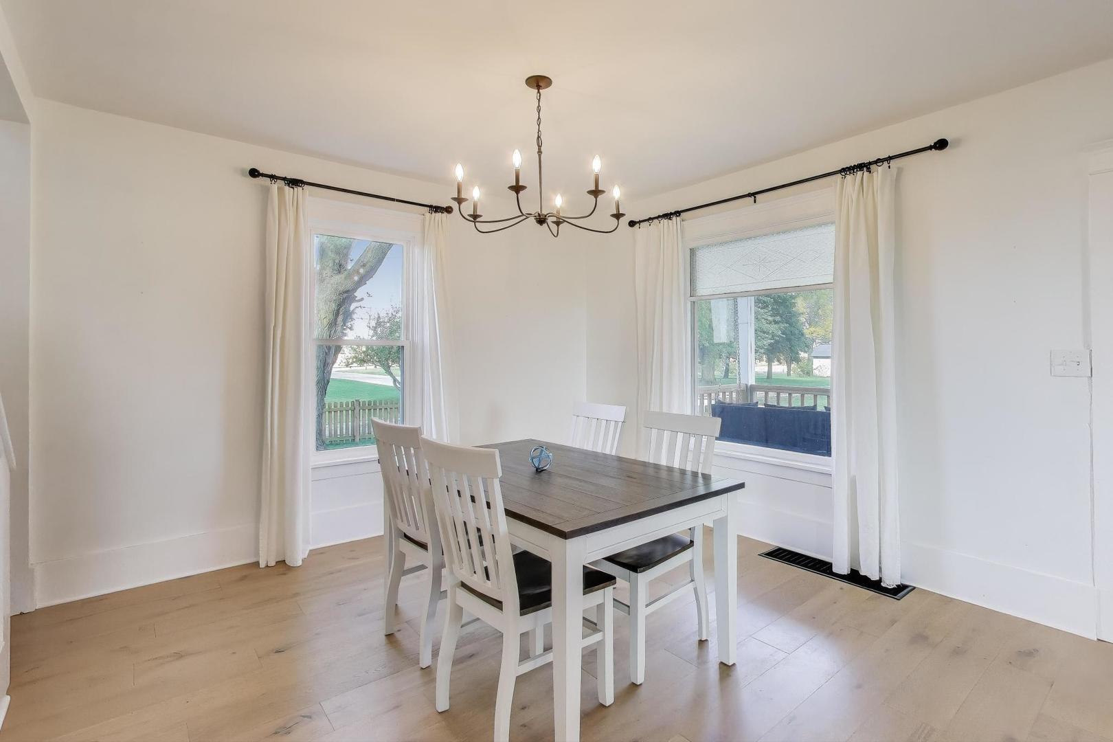 17128 Lukens Road Sycamore, IL 60178 - Photo 10 of 45 a view of a dining room with furniture window and wooden floor