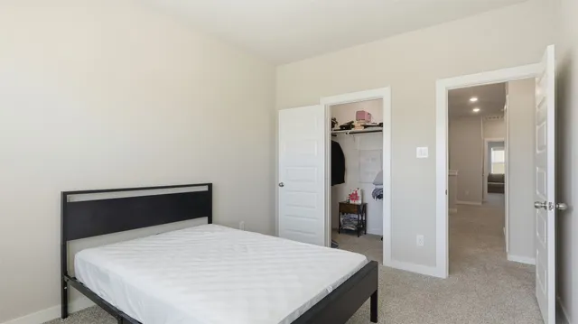 a bedroom with a bed and a table