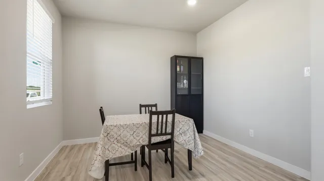 a view of a room with a table and chair