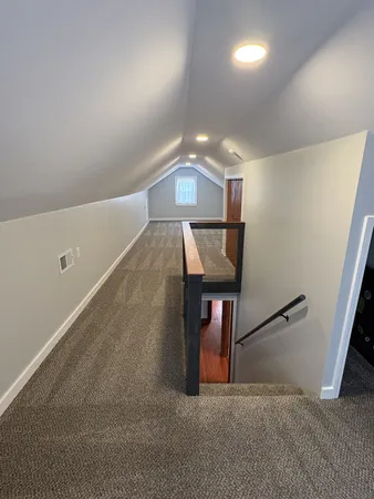 a view of a hallway with a room