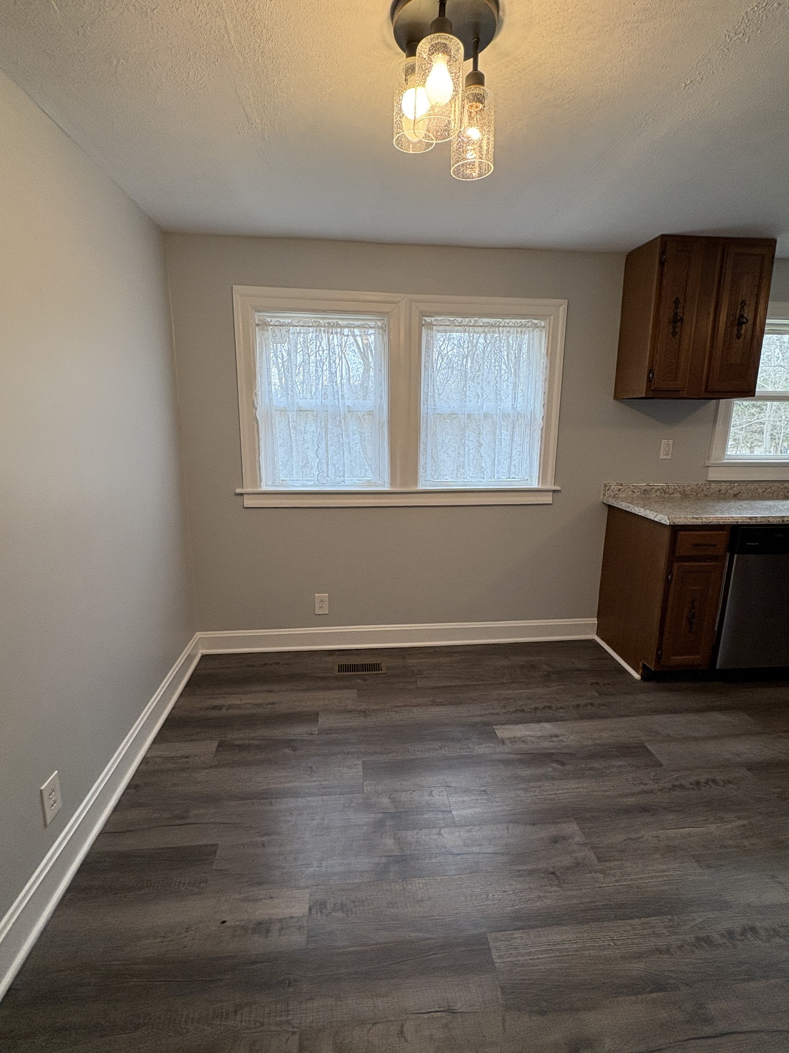 1546 Bobby Road Clarksville, TN 37040 - Photo 8 of 21 a view of an empty room with wooden floor and a window
