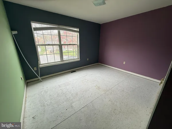 an empty room with windows