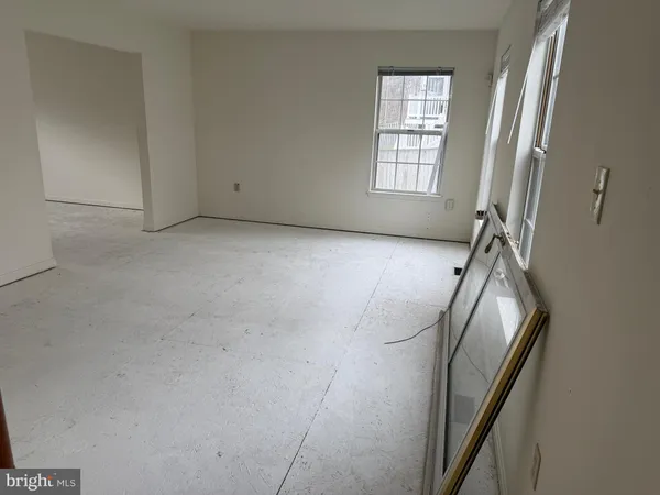 a view of empty room with windows